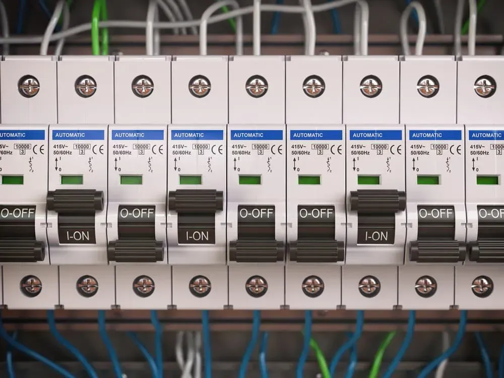A Close-up of a Series of Electrical Circuit Breakers Mounted in a Row — CH Electrics in Emerald, QLD