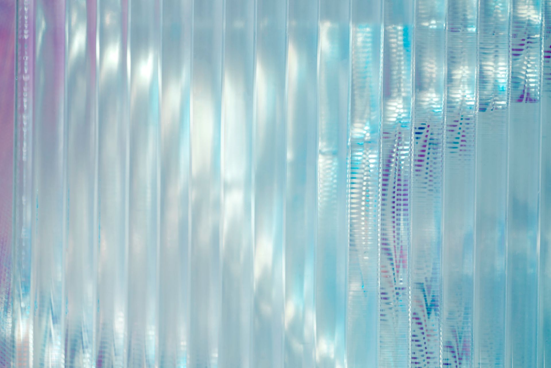 A close up of a blue curtain with a reflection of the sun. A close up of a blue curtain with a reflection of the sun.