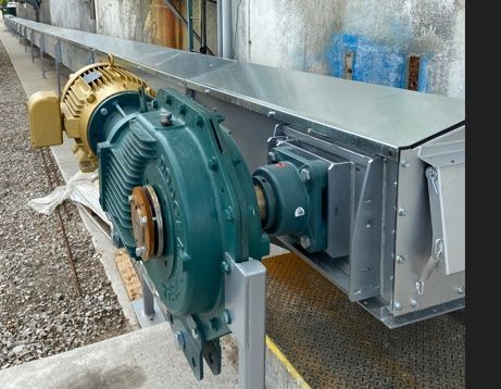 A conveyor belt with two motors attached to it
