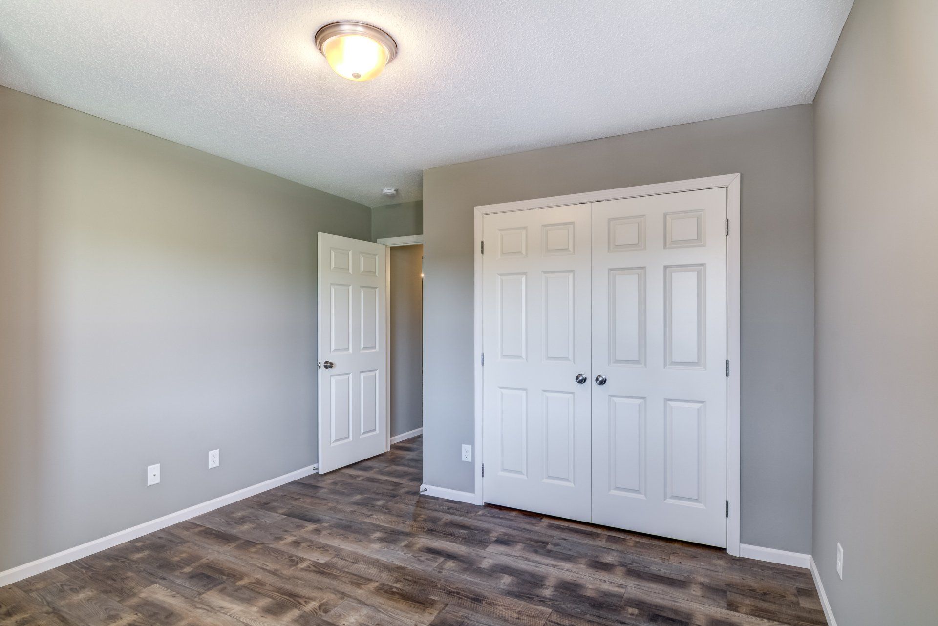 New Richmond bedroom photo with double door closet