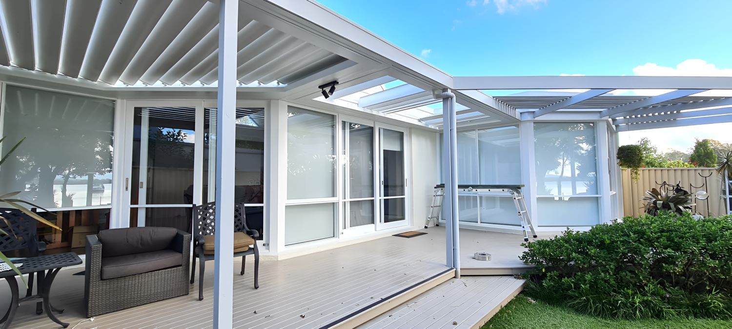 A Living Room With a Staircase and a Sliding Glass Door — JAX Painting Services in Lake Macquarie, NSW