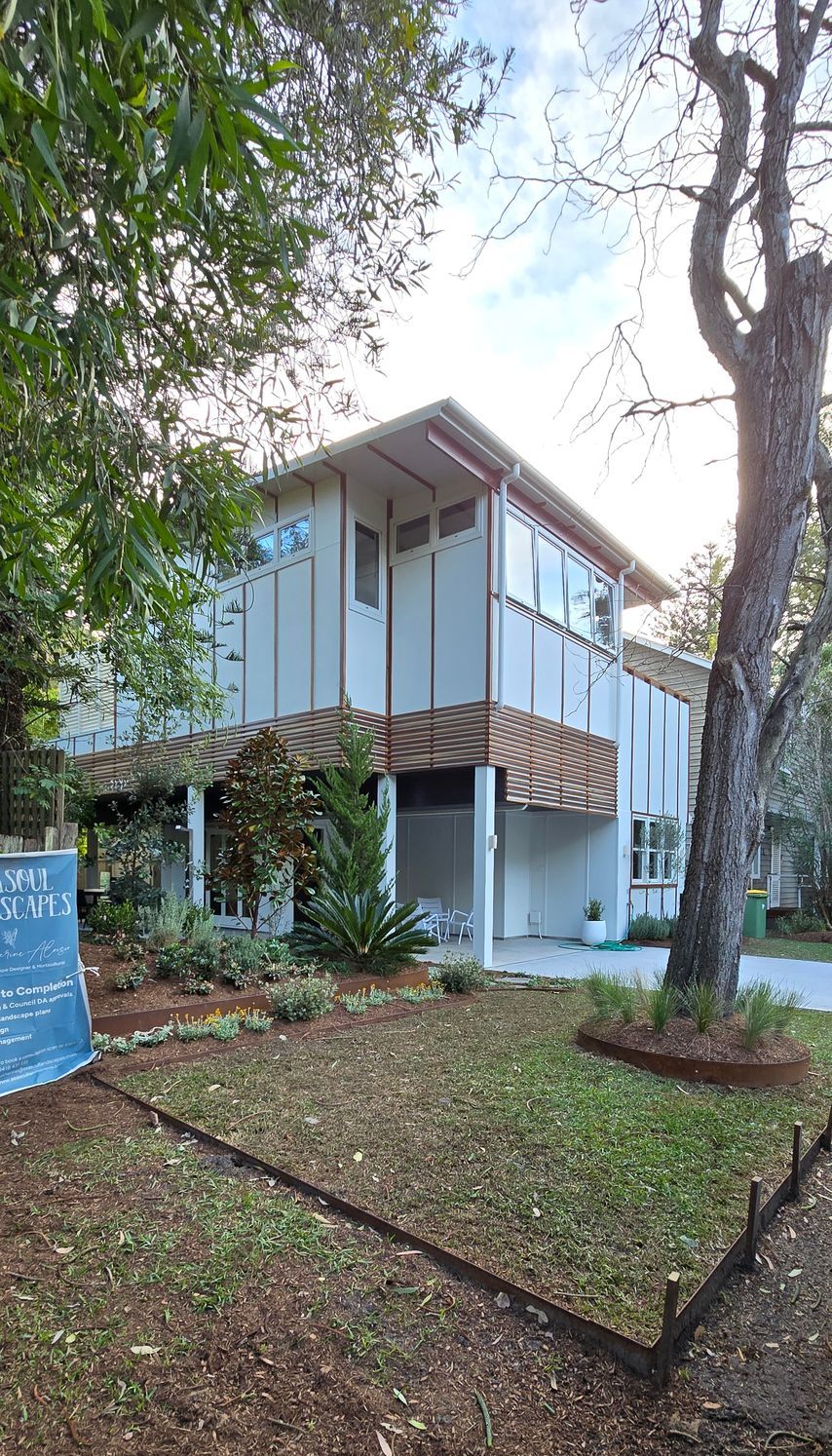 A house that is being painted with a ladder in the backyard — JAX Painting Services in Central Coast, NSW