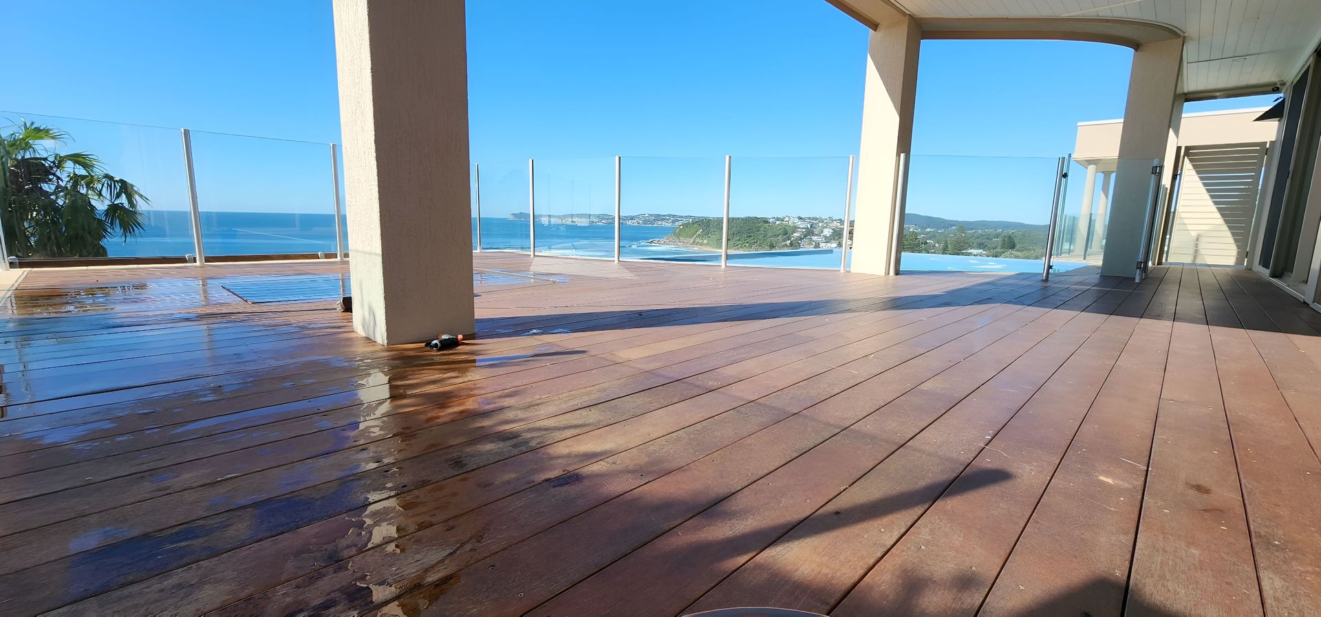 A Wooden Deck With a View of the Ocean — JAX Painting Services in Lake Macquarie, NSW