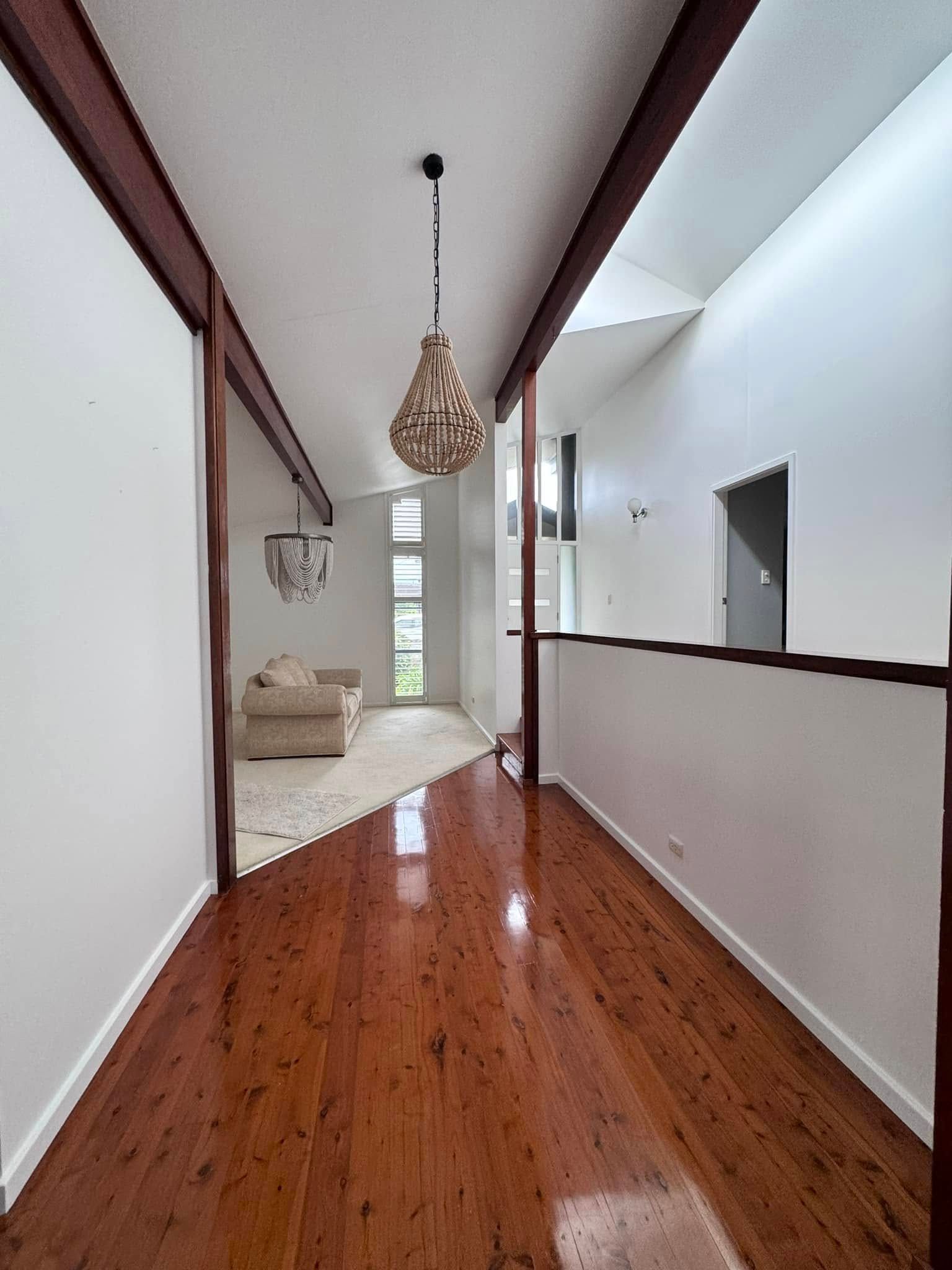 A Living Room With Windows and a Ceiling Fan — JAX Painting Services in Central Coast, NSW