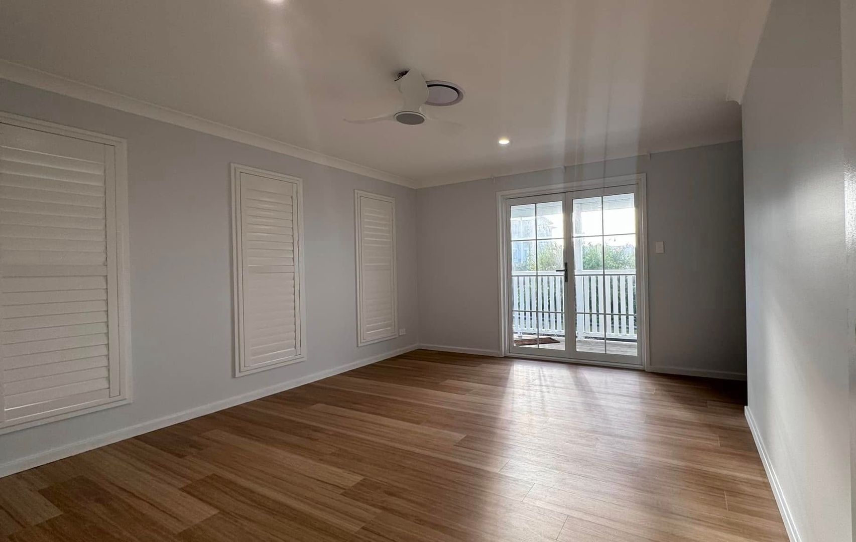A Living Room With a Table and Chairs and a Box on the Floor — JAX Painting Services in Gosford, NSW