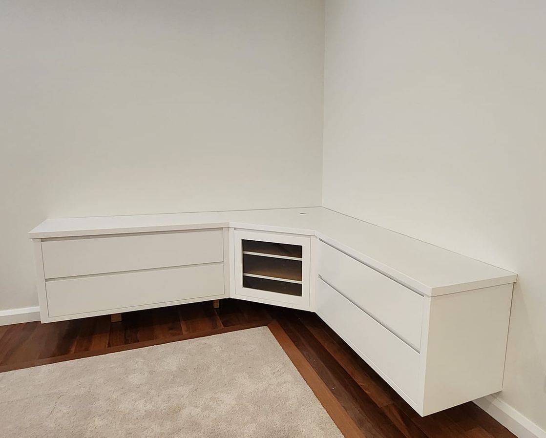 A Living Room With a Ceiling Fan and a Couch Covered in Plastic — JAX Painting Services in Central Coast, NSW