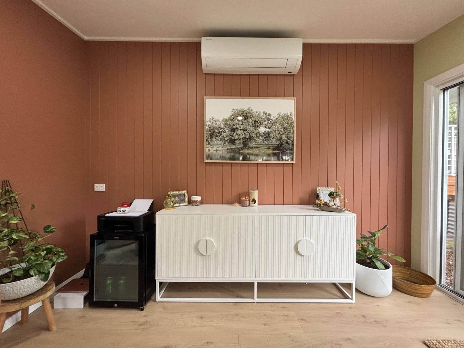 A Living Room With a Couch and a Sliding Glass Door — JAX Painting Services in Central Coast, NSW