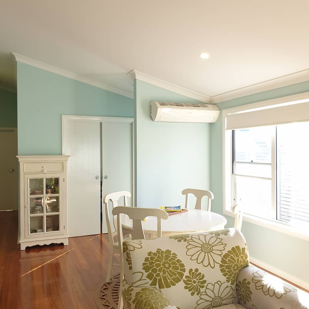 A Living Room With a Table and Chairs in It — JAX Painting Services in Central Coast, NSW