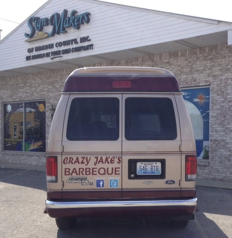 Red van parked outside Crazy Jake’s Barbecue restaurant storefront. Red van parked outside Crazy Jake’s Barbecue restaurant storefront.