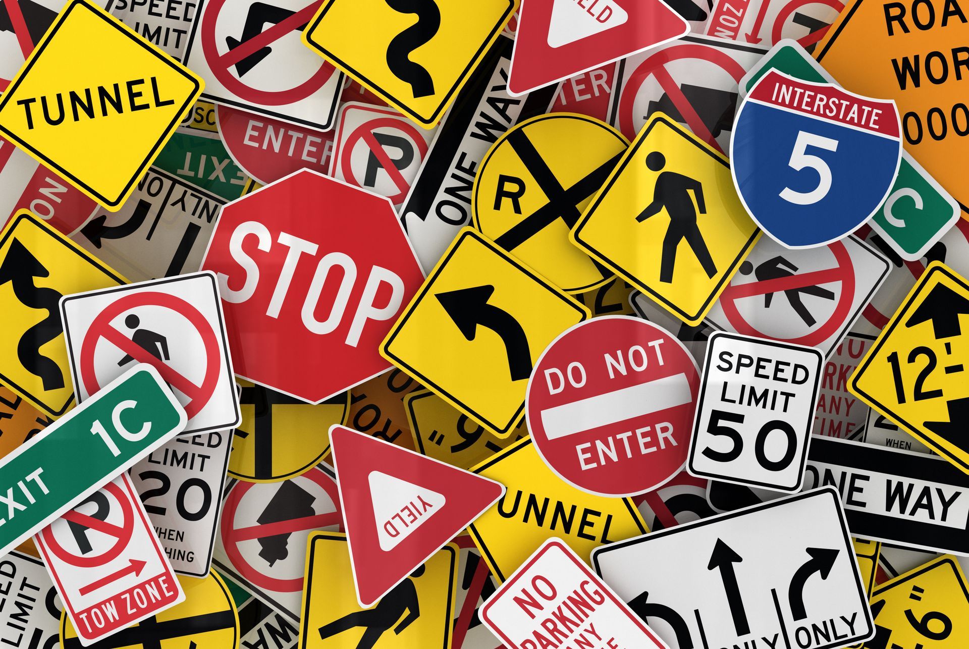 Assorted colorful road traffic signs, including stop, speed limit, and no entry signs, overlapping densely Assorted colorful road traffic signs, including stop, speed limit, and no entry signs, overlapping densely