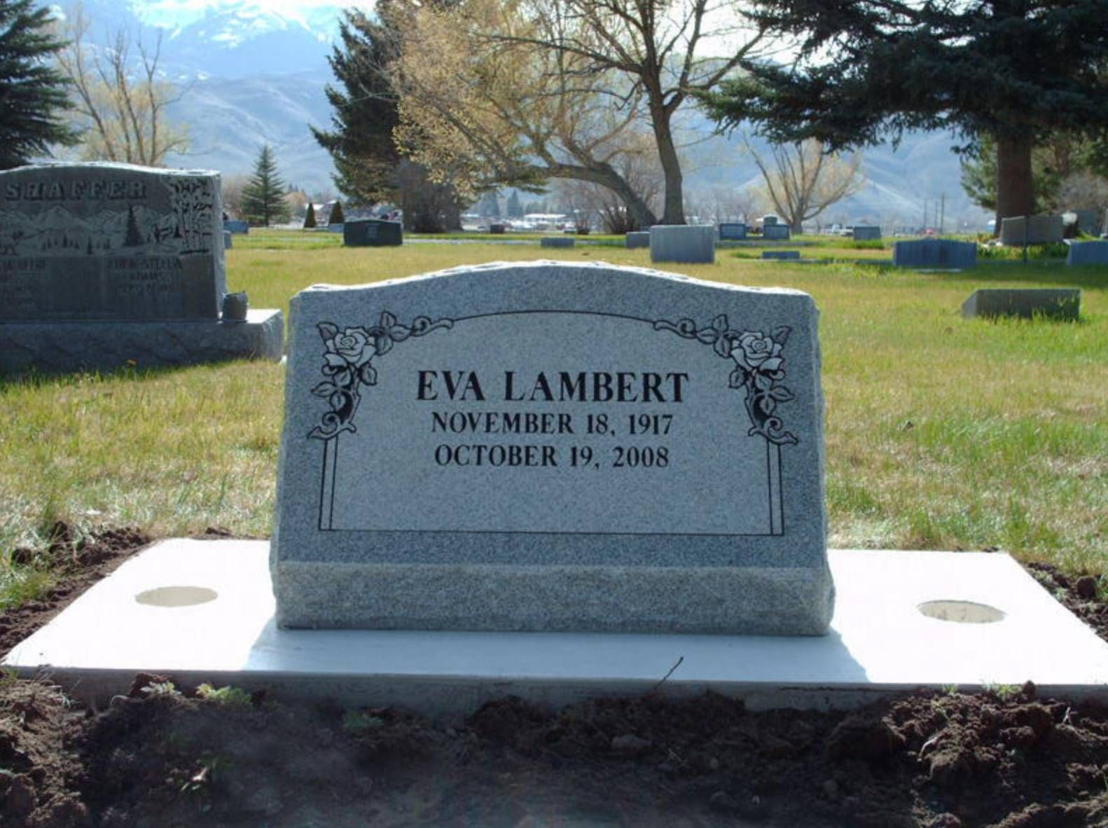 Custom engraved granite grave marker at a Utah cemetery