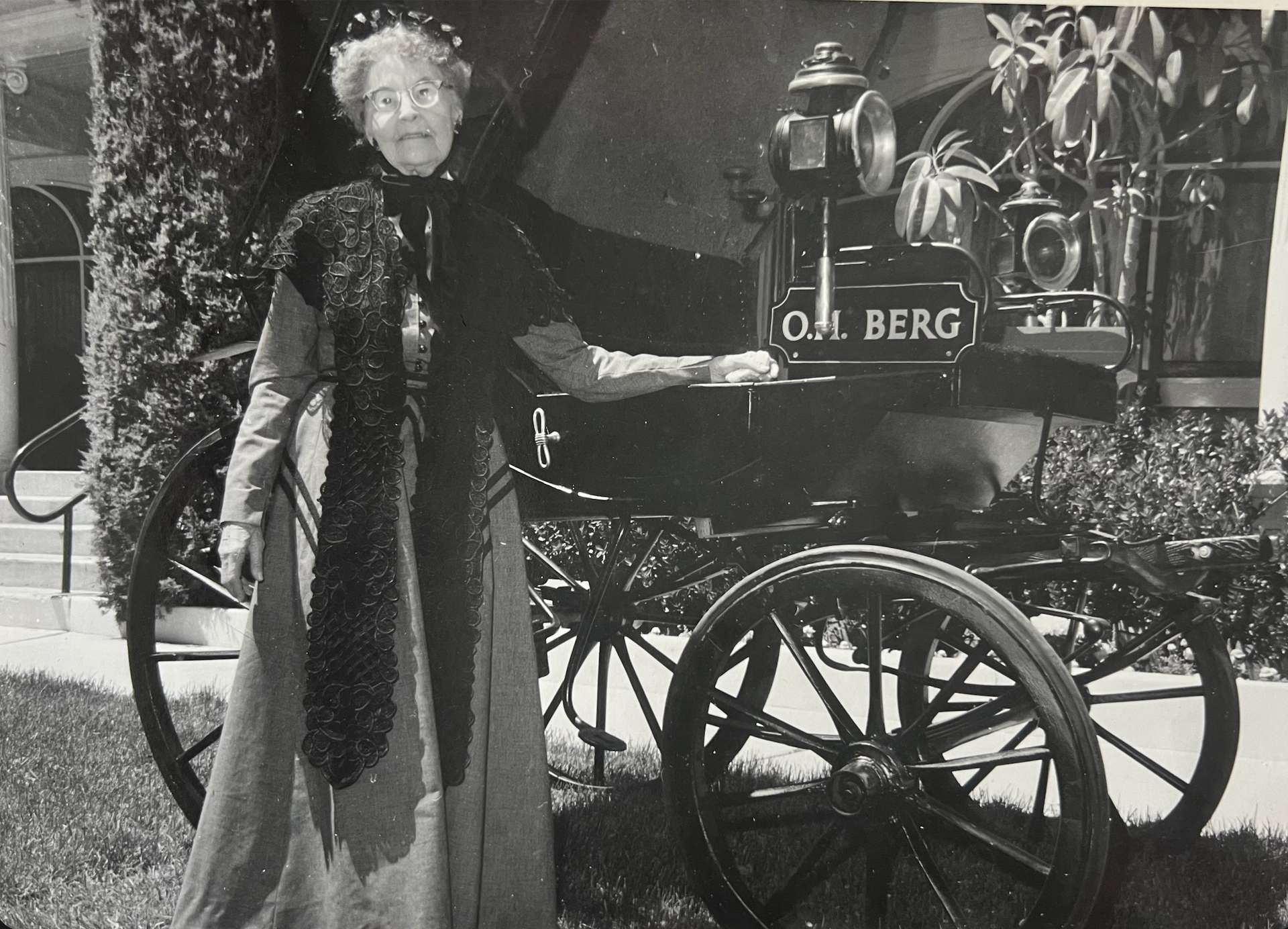 Viva Berg with an early Berg Mortuary funeral car in Provo