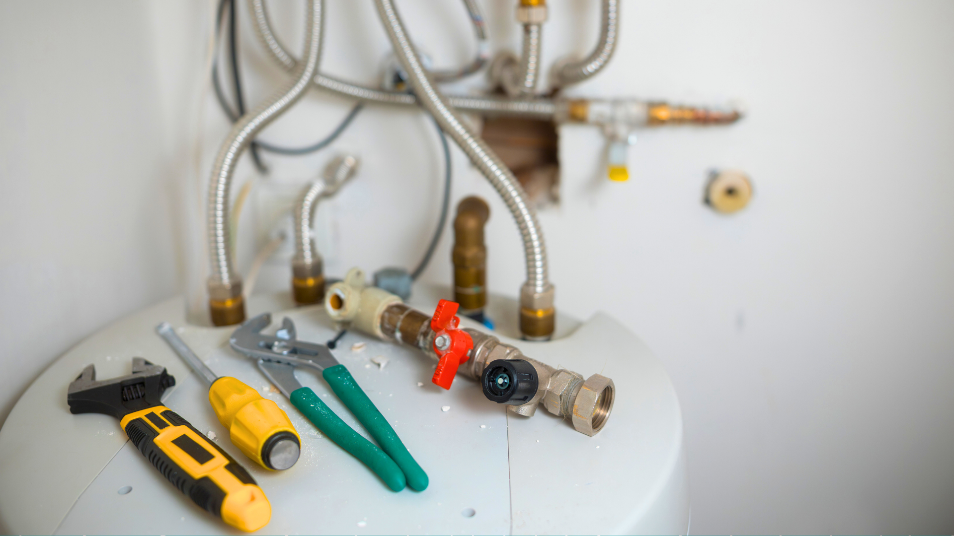 Tools laying on a hot water heater