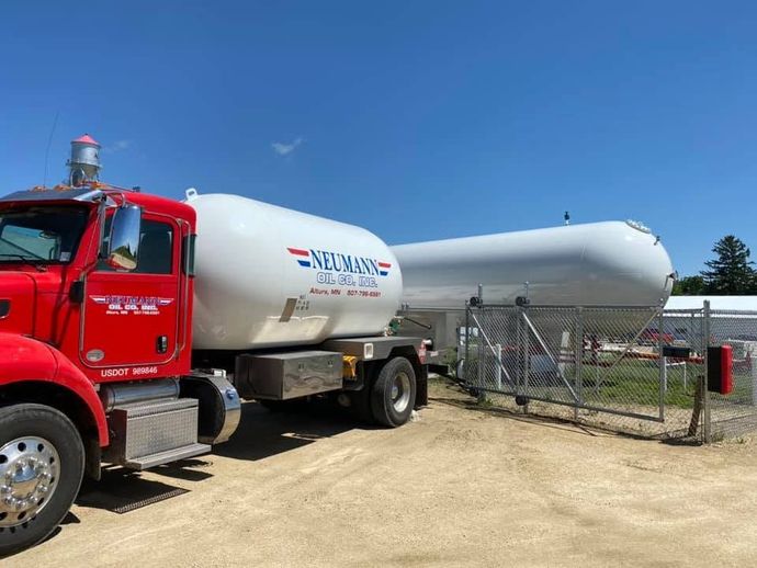 Neumann Oil Company propane delivery truck getting fuel from tank