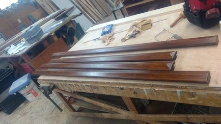 A wooden table with a bunch of wood on it.