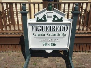 A sign for figueiredo carpenter and custom builder in marion ma