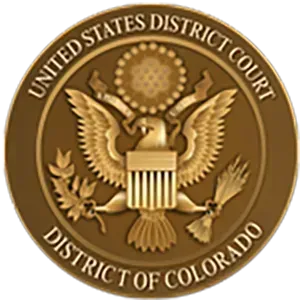 Seal of the U.S. District Court, District of Colorado, with a gold eagle on a brown circular emblem