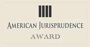 American Jurisprudence Award logo with four black vertical bars on a beige background
