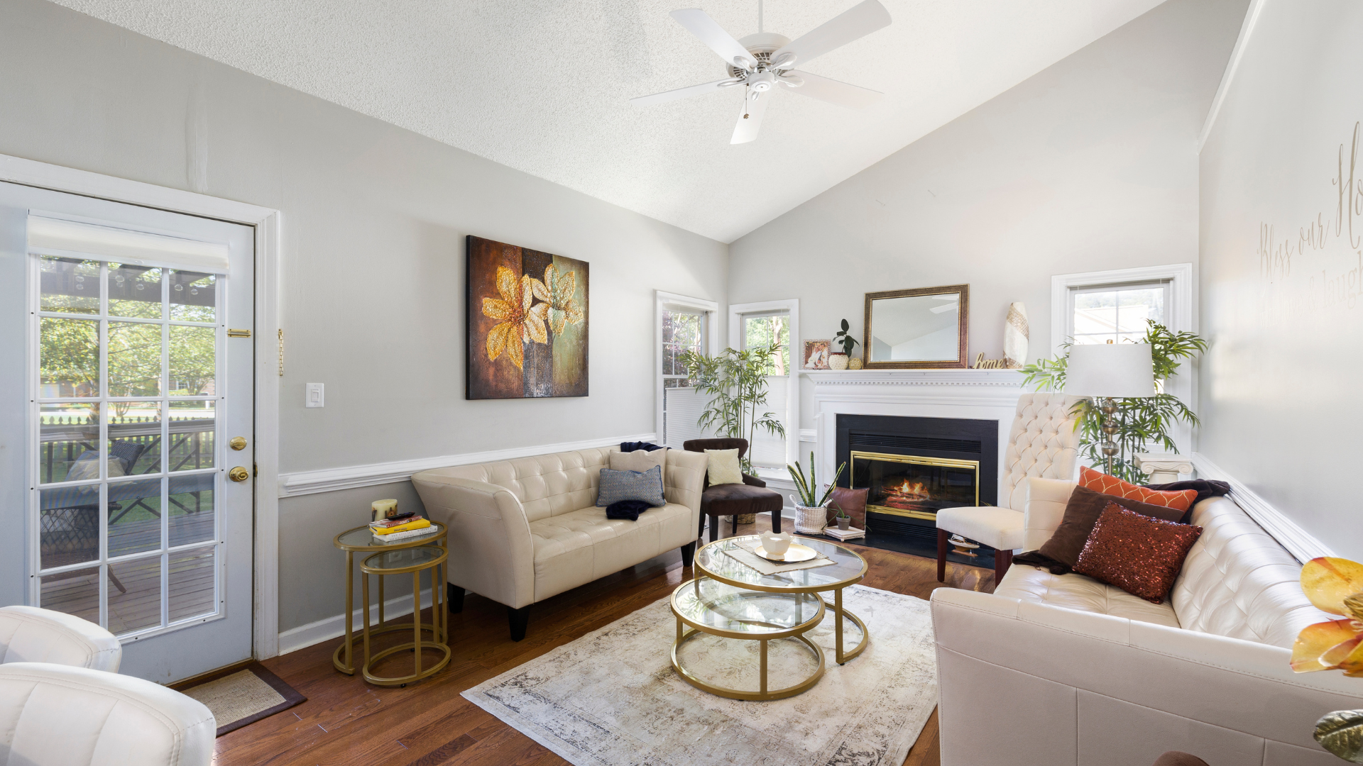 A living room filled with furniture and a fireplace.