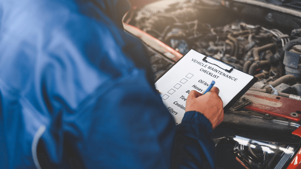 a mechanic doing a car diagnostic 
