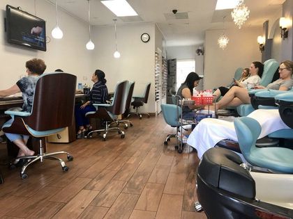 A Group Of People Sitting In Chairs In A Nail Salon — San Diego, CA — Summer Nails and Spa A Group Of People Sitting In Chairs In A Nail Salon — San Diego, CA — Summer Nails and Spa