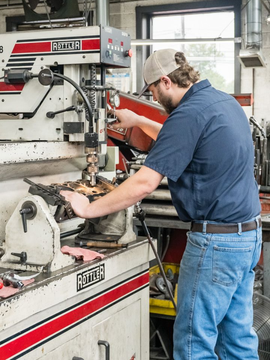 A Rottler engine cylinder head resurfacing machine in use.