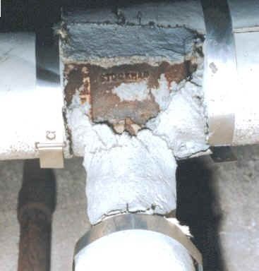 A close up of a pipe with rust on it.