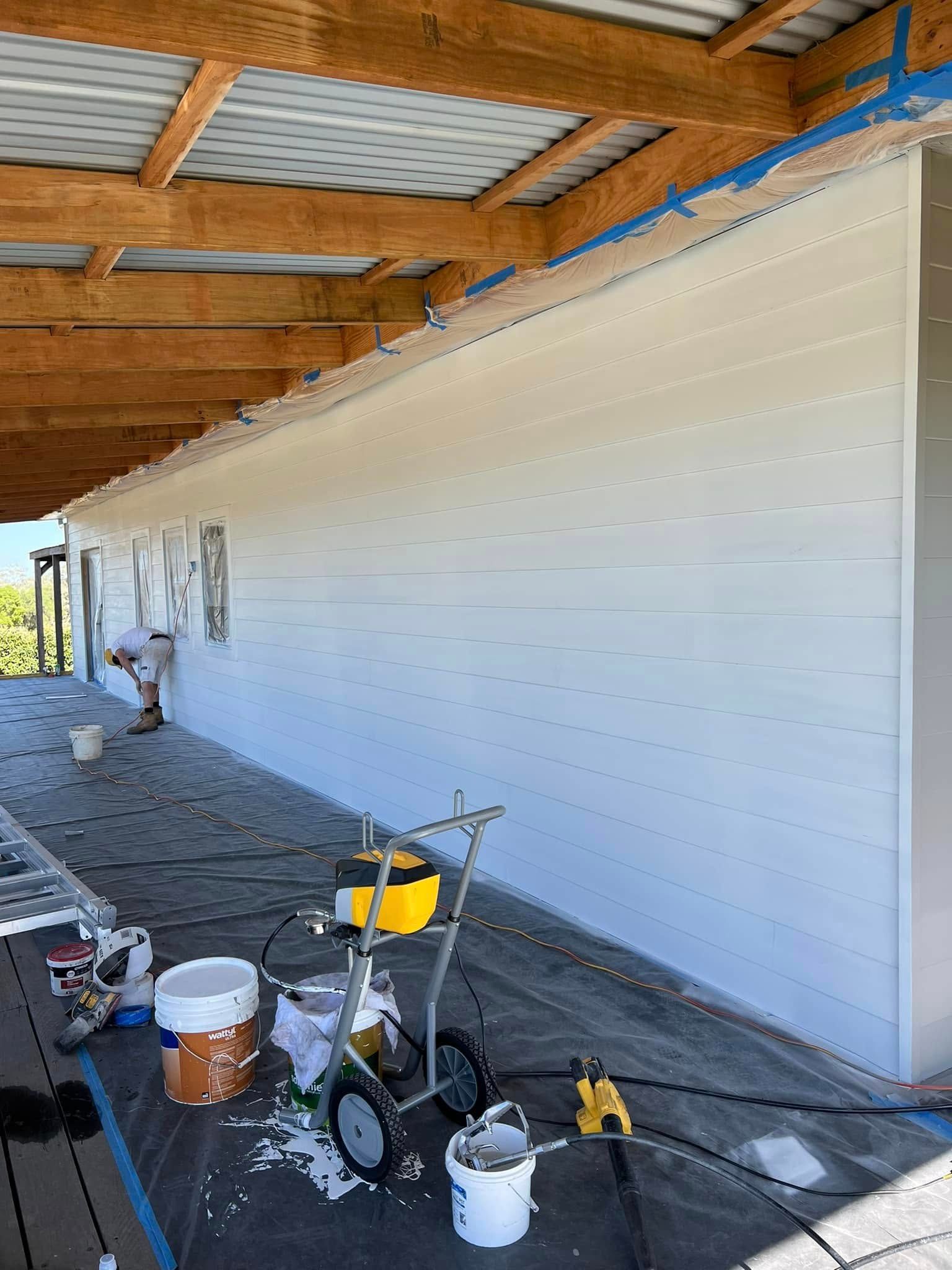 Covered Walkway with A Long White Wall Being Painted — Matty Stewart Painting & Decorating in Mudgee, NSW