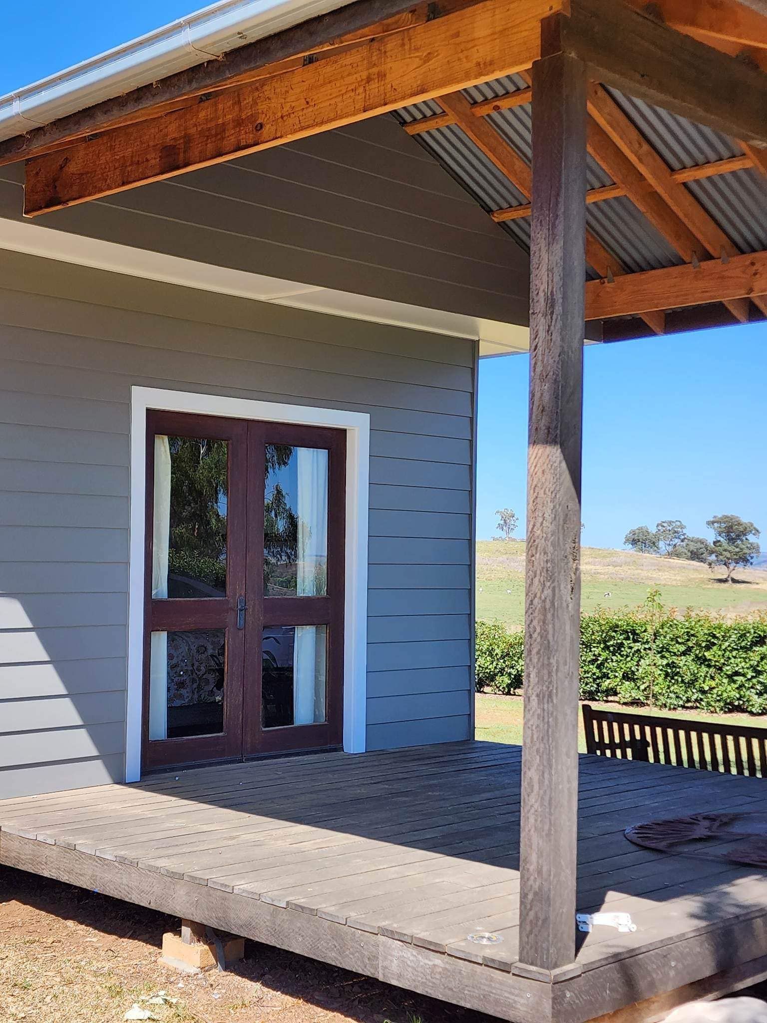 Covered Porch with Wooden Post and A House Exterior — Matty Stewart Painting & Decorating in Dubbo, NSW