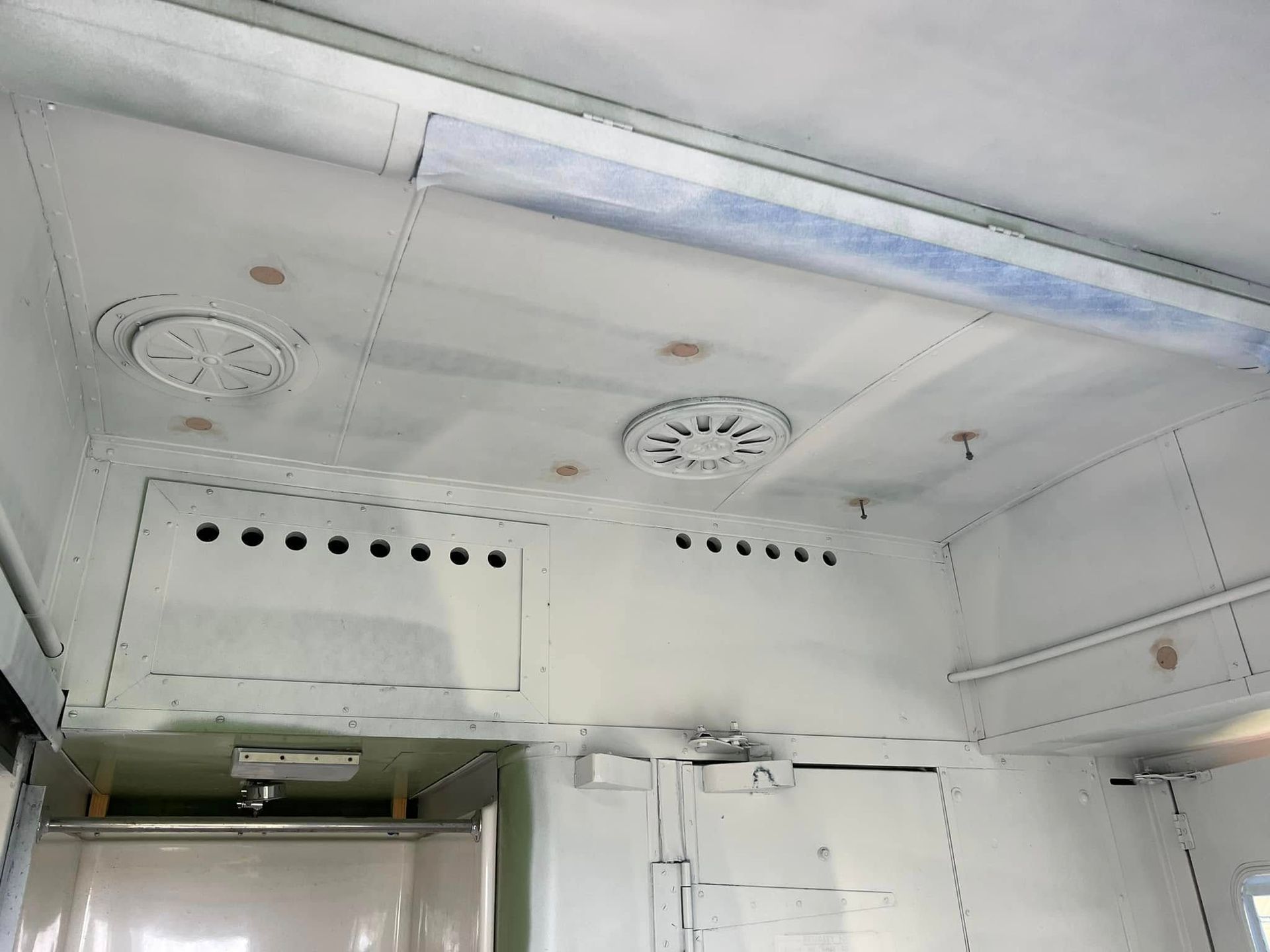 White Metal Interior with Vents and Perforated Panels Inside a Vehicle — Matty Stewart Painting & Decorating in Mudgee, NSW