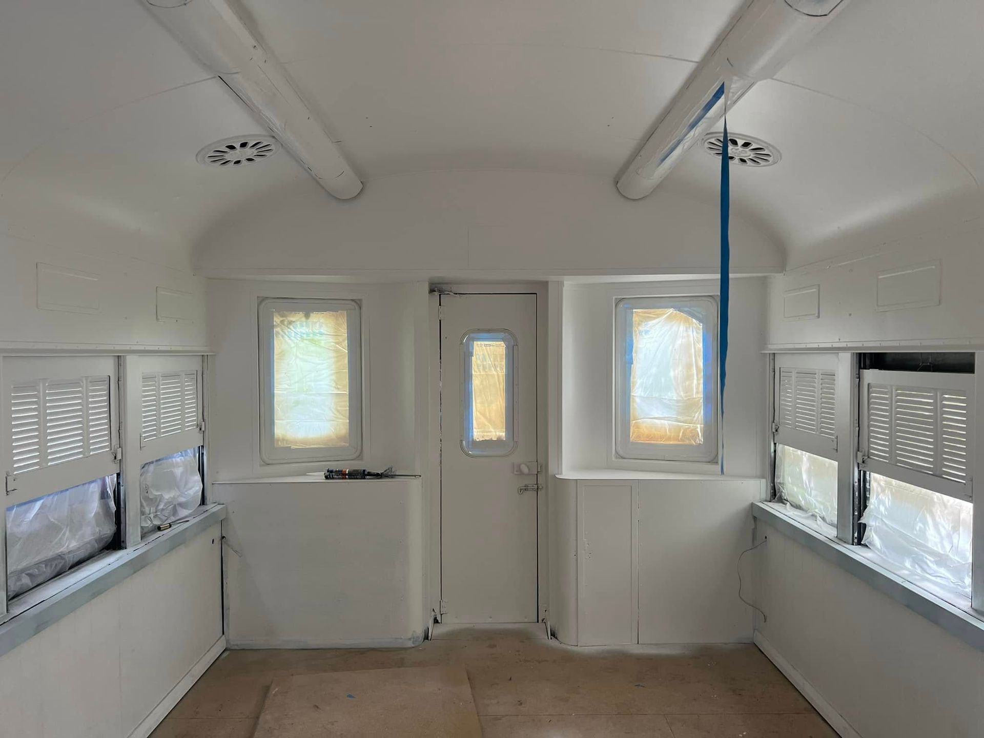 Interior of A Small White Train Car — Matty Stewart Painting & Decorating in Mudgee, NSW