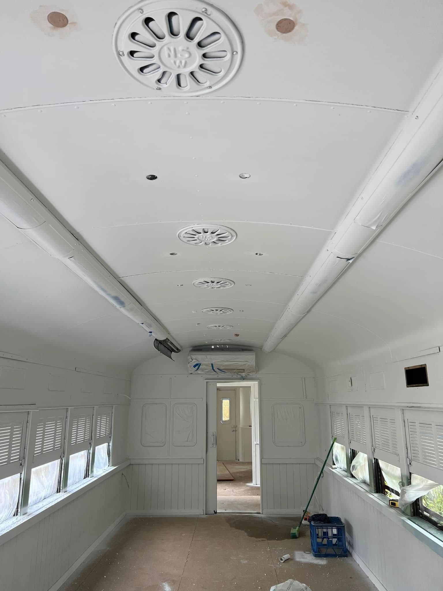 White Train Car Interior with Paneled Walls — Matty Stewart Painting & Decorating in Bathurst, NSW