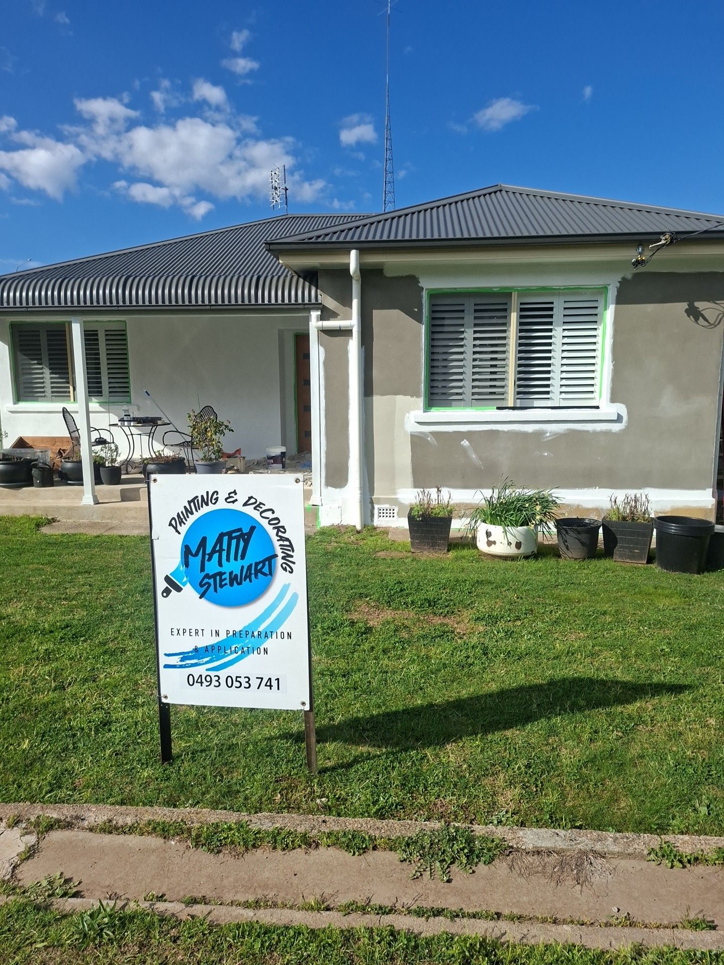 Single Story House with A Lawn and A Sign in The Front Yard — Matty Stewart Painting & Decorating in Mudgee, NSW