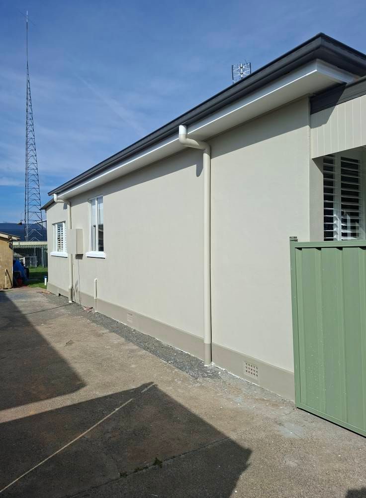 White Exterior Wall of A House with A Green Gate — Matty Stewart Painting & Decorating in Bathurst, NSW