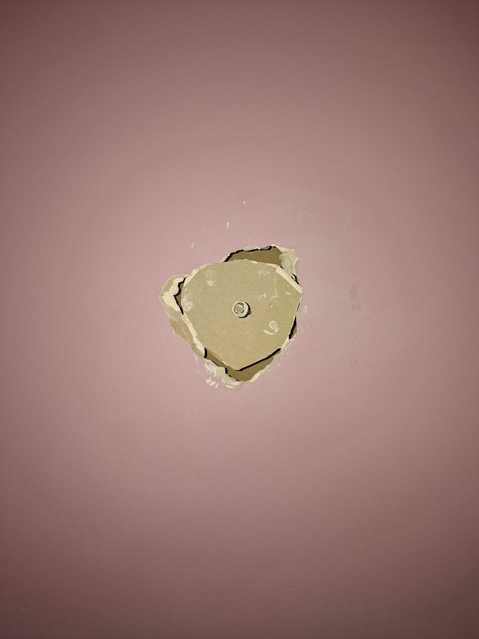 Pink Wall With a Chipped Hole — Matty Stewart Painting & Decorating in Mudgee, NSW