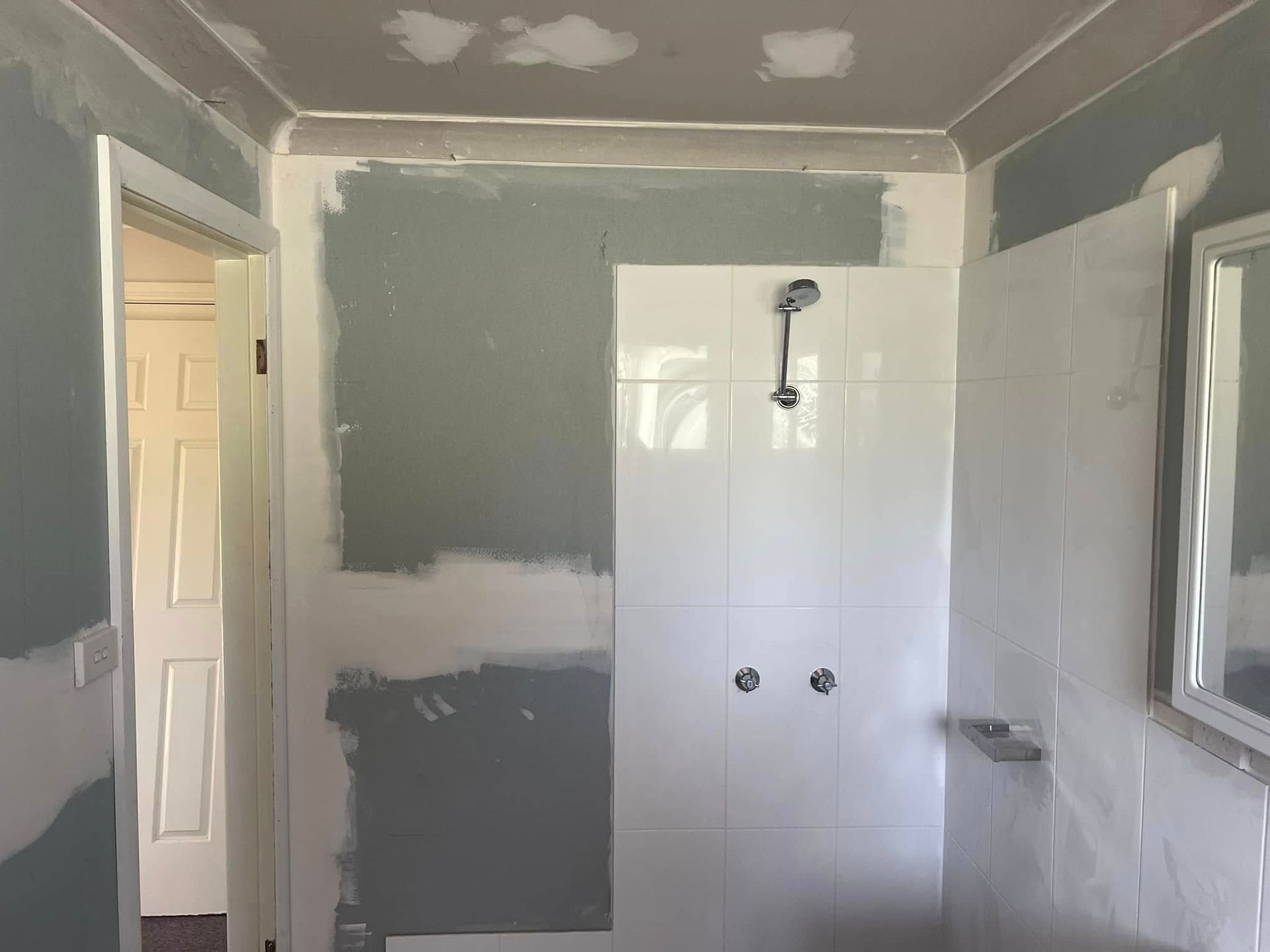Partially Renovated Bathroom with Gray Drywall — Matty Stewart Painting & Decorating in Mudgee, NSW