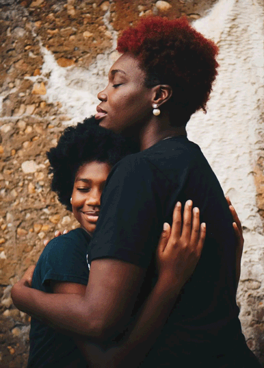 Mother and daughter hugging