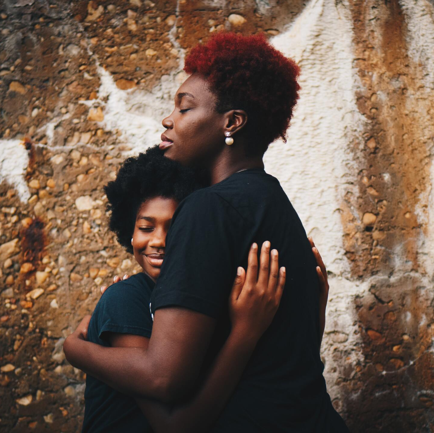 Mother and daughter hugging