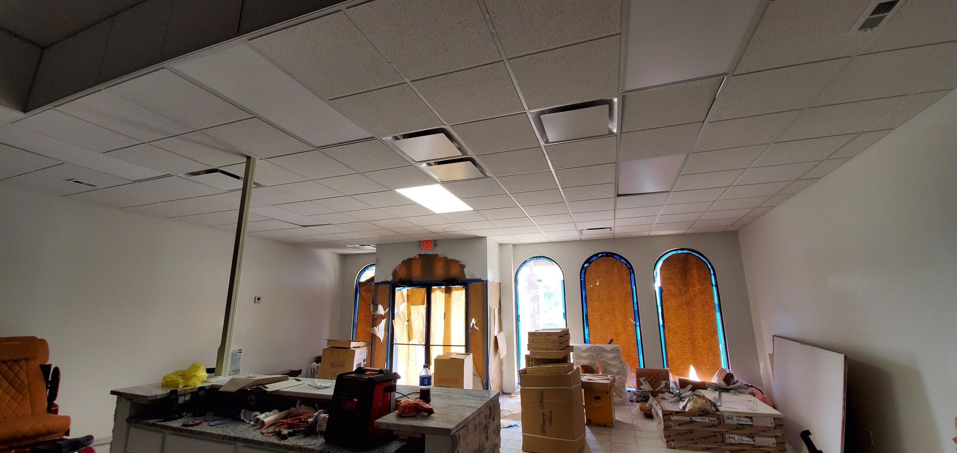 A large room with a ceiling that is being remodeled.