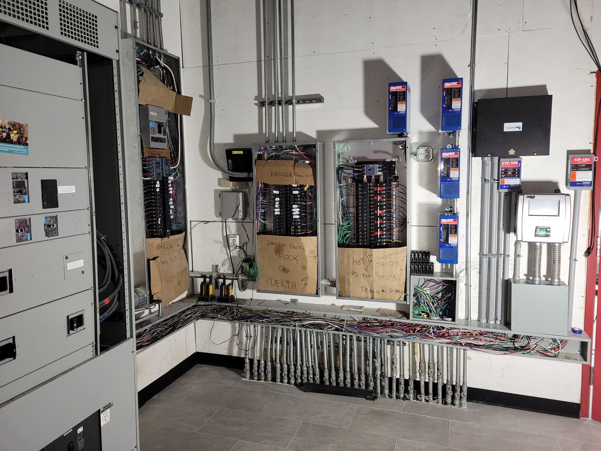 A room with a lot of electrical equipment on the wall