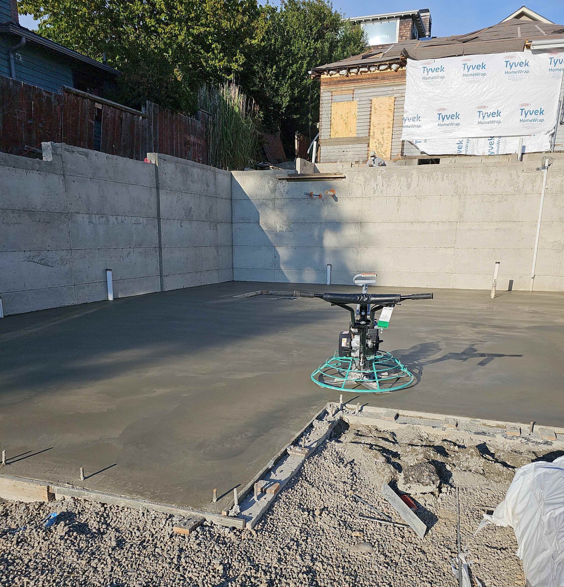A machine is sitting on top of a concrete floor.