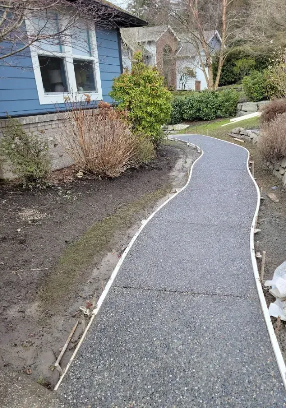 a concrete sidewalk is being built in front of a house in Bellingham Washington.