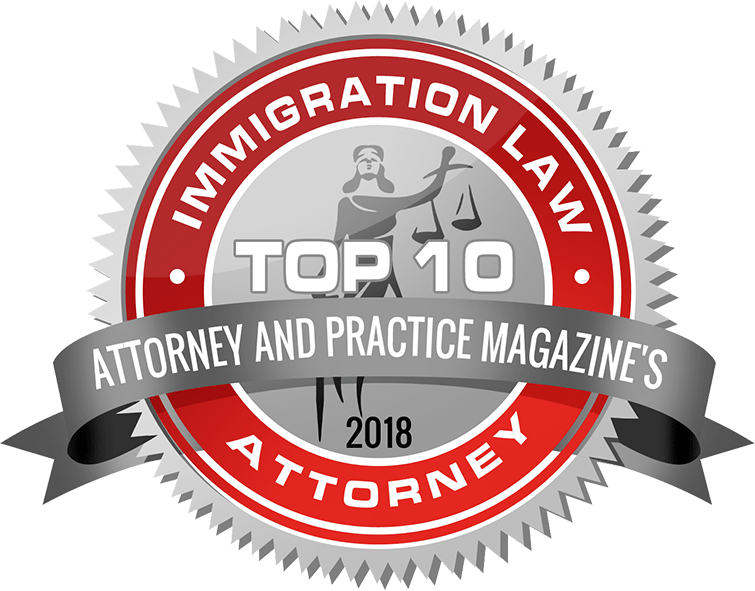A badge that says immigration law top 10 attorney and practice magazine's attorney.