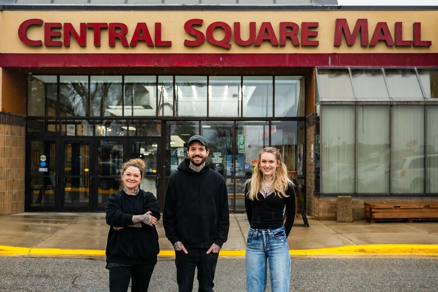 Three people stand in front of 
