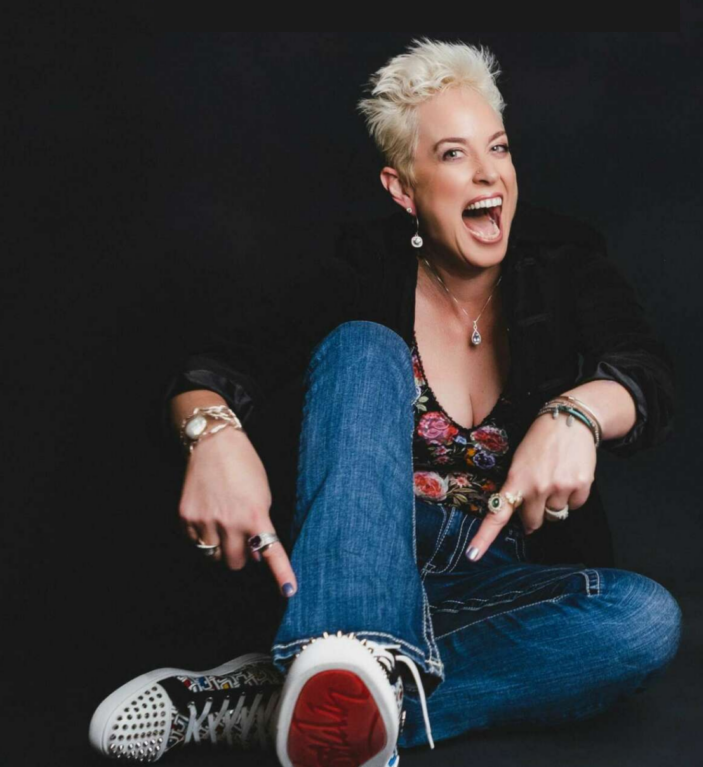 Julie Jones pointing down at her shoes