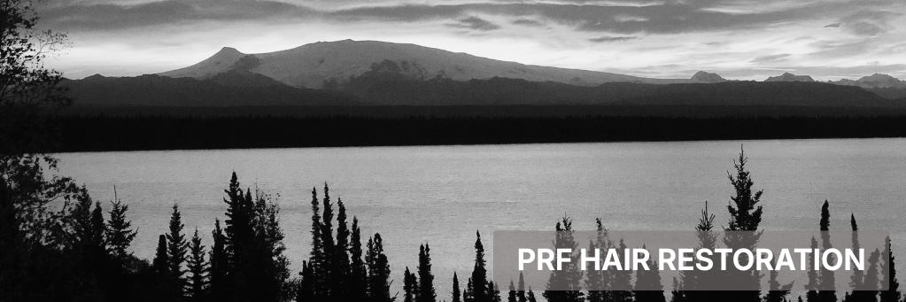 Black-and-white mountain lake landscape with trees and the text “PRP HAIR RESTORATION” in the lower right.