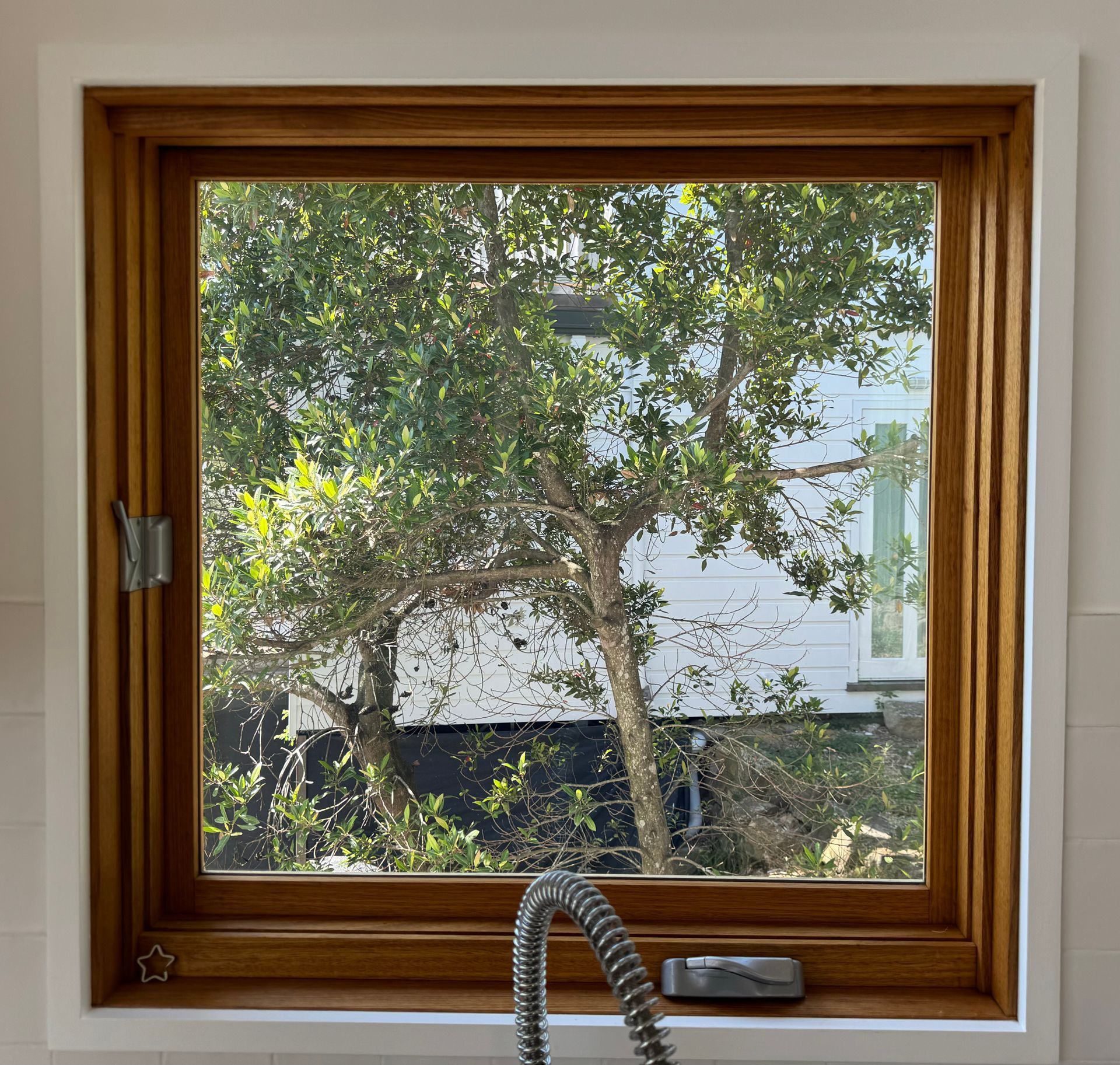 Wood-framed Kitchen Window Looking Out Onto Leafy Trees — Fineworx Joinery in Warnervale, NSW