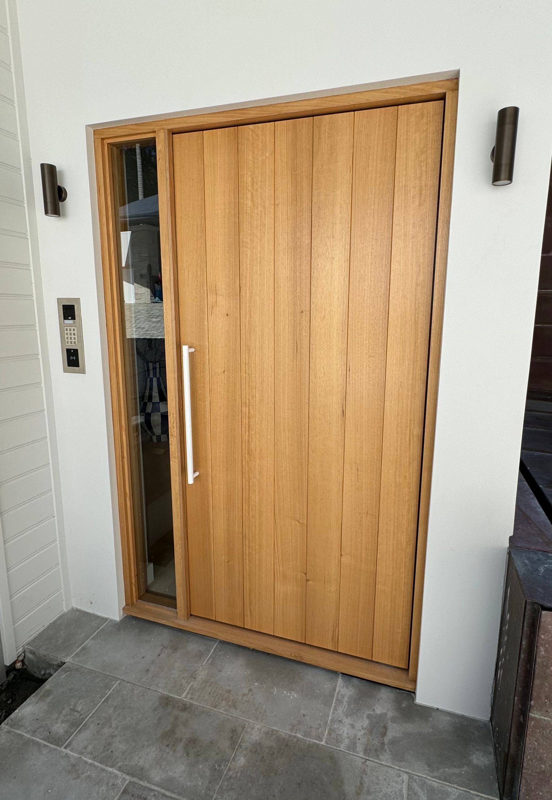 Wood-framed Front Door With Vertical Glass Panel Beside It and Gray Tile Floor — Fineworx Joinery in Warnervale, NSW