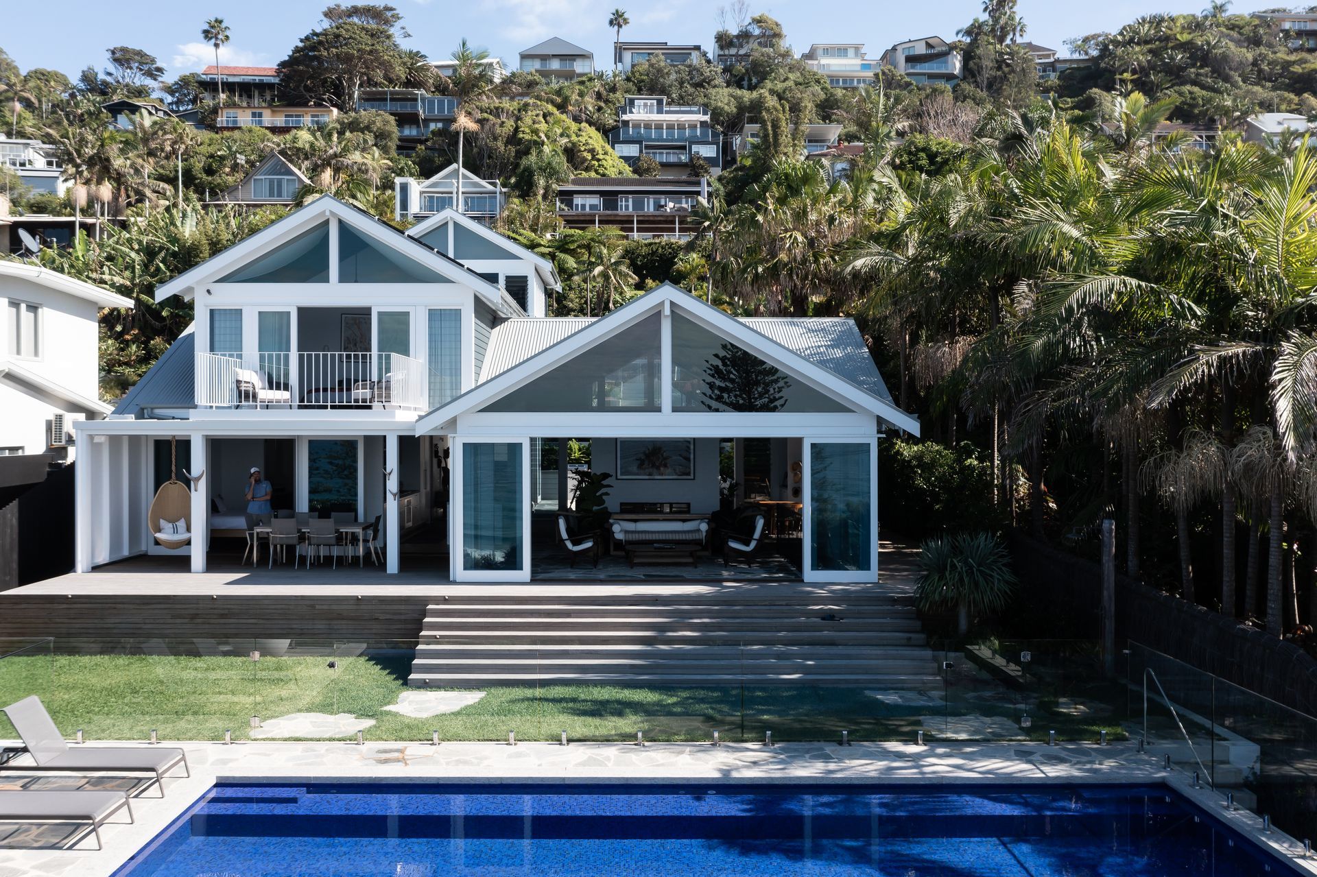 Blue-and-white House With a Pool, Set on a Lush Hillside Under a Clear Sky — Fineworx Joinery in Warnervale, NSW