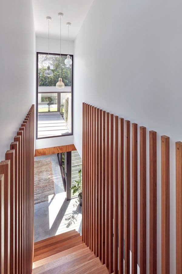 Modern Staircase with Wood Slat Railing and White Walls — Fineworx Joinery in Warnervale, NSW